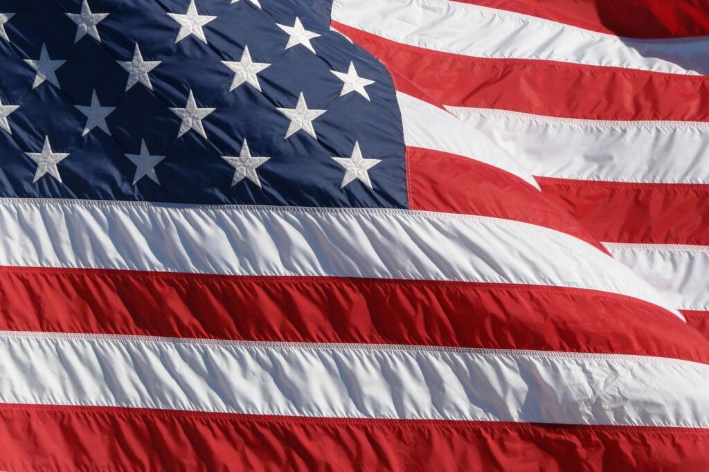 A close-up of the American flag waving in the wind.