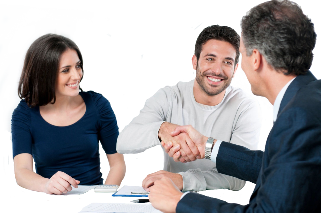 Two men shaking hands during a business meeting, woman observing.