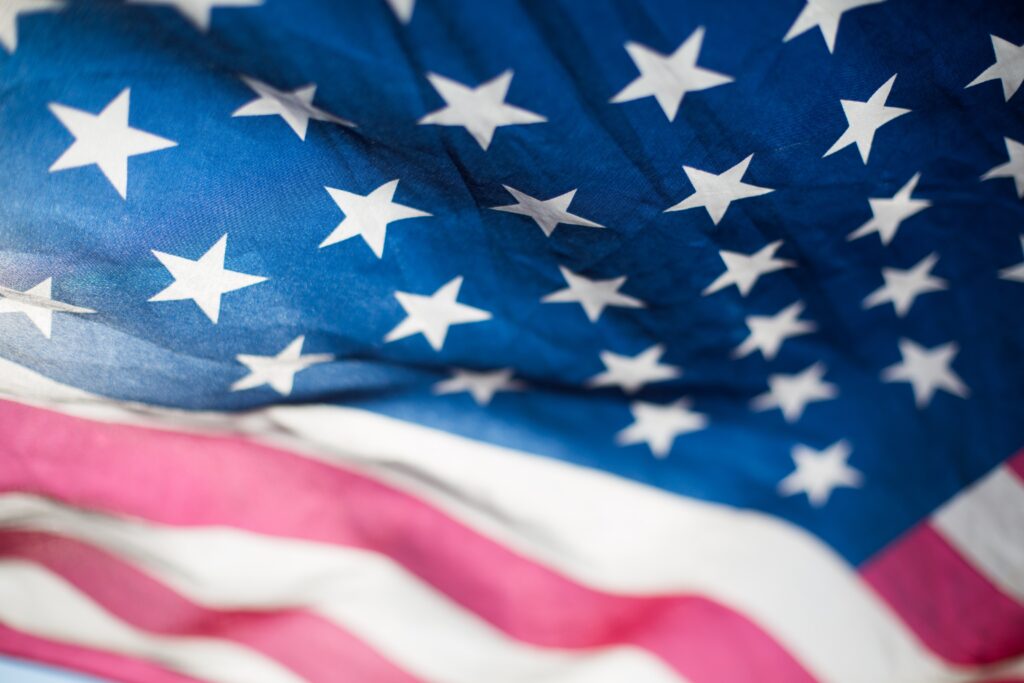 Close-up of the American flag showing stars and stripes.